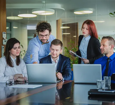 A group of team members having a discussion in meeting room